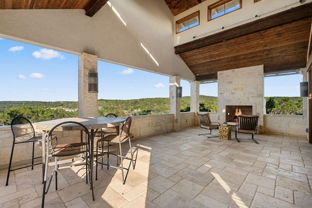 11949 Overlook Pass, Austin, TX 78738 - view of patio / terrace featuring an outdoor stone fireplace and outdoor dining area