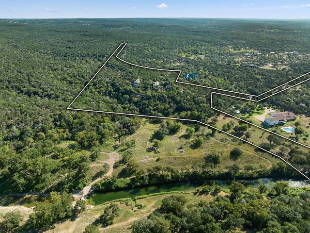 11949 Overlook Pass, Austin, TX 78738 - aerial view of property and surrounding area with property parcel outlined and a heavily wooded area