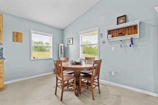 726 Mesa Dr, Del Valle, TX 78617 - dining room featuring lofted ceiling, plenty of natural light, and baseboards