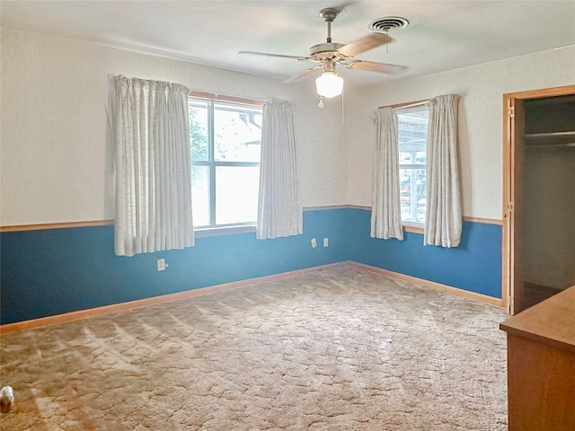 419 N Knox Ave, Giddings, TX 78942 - unfurnished bedroom featuring carpet, a closet, ceiling fan, and baseboards