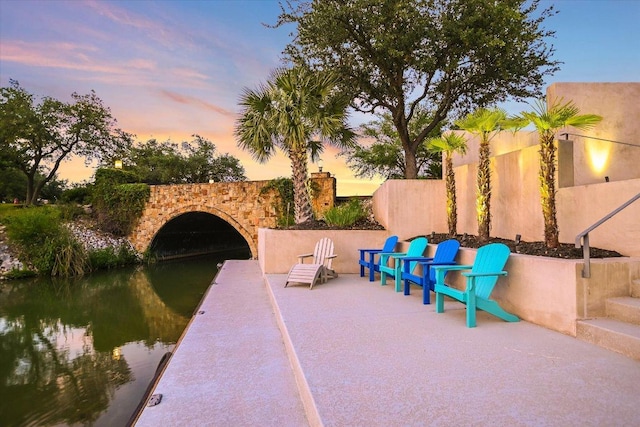 view of patio / terrace with a water view