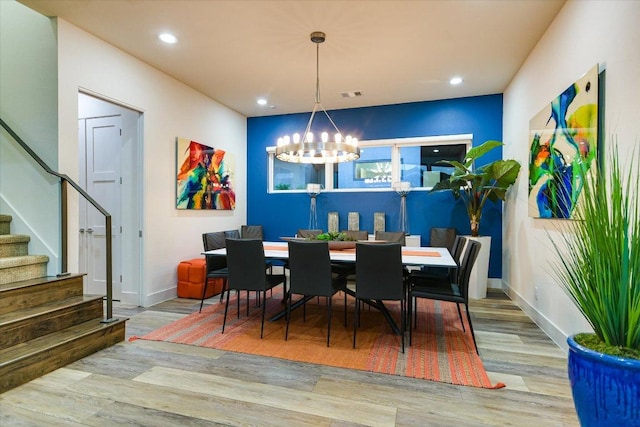 116 Wennmohs Pl, Horseshoe Bay, TX 78657 - dining area featuring stairs, a chandelier, wood finished floors, recessed lighting, and baseboards