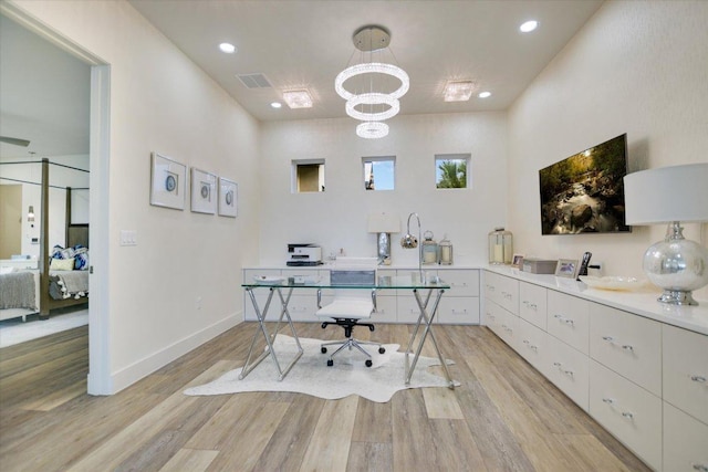 office featuring light wood-style floors, a chandelier, recessed lighting, and baseboards