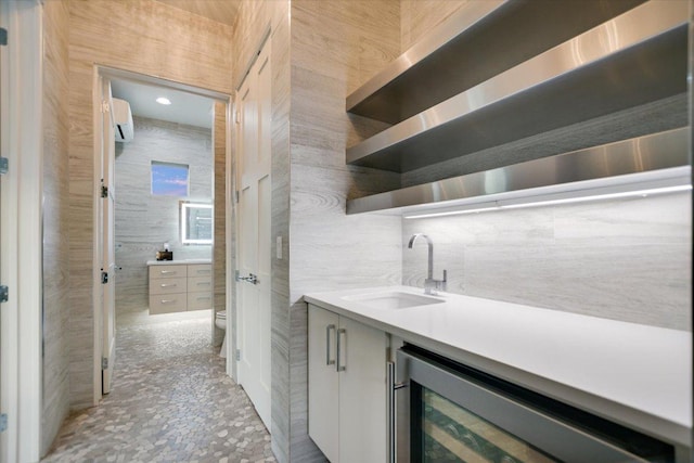 116 Wennmohs Pl, Horseshoe Bay, TX 78657 - indoor bar with wine cooler, an AC wall unit, and tile walls