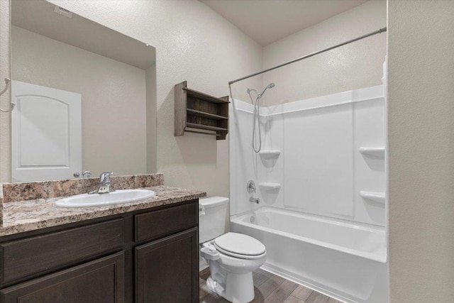 321 Freedom Park Ave, Liberty Hill, TX 78642 - full bathroom featuring wood finished floors, vanity, toilet, and shower / bathtub combination
