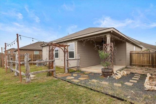 321 Freedom Park Ave, Liberty Hill, TX 78642 - rear view of property with a patio and central AC