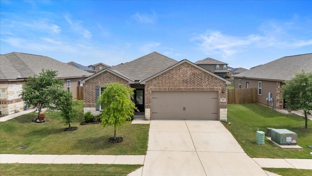 321 Freedom Park Ave, Liberty Hill, TX 78642 - view of front of property featuring brick siding, a garage, and concrete driveway