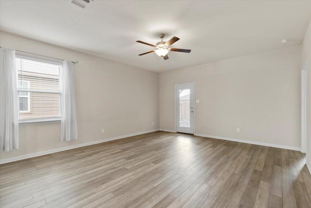 321 Freedom Park Ave, Liberty Hill, TX 78642 - empty room featuring a ceiling fan, light wood-style flooring, and baseboards