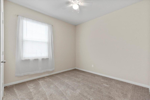 321 Freedom Park Ave, Liberty Hill, TX 78642 - spare room featuring light colored carpet and baseboards