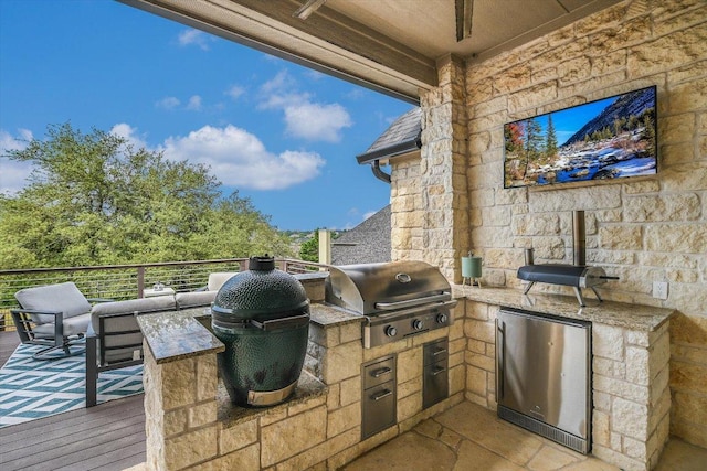 view of patio featuring grilling area and exterior kitchen