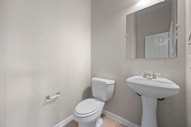 2640 Estefania Ln, Round Rock, TX 78665 - half bath featuring toilet and tile patterned flooring