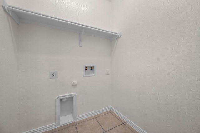 2640 Estefania Ln, Round Rock, TX 78665 - laundry area with gas dryer hookup, tile patterned floors, hookup for an electric dryer, and washer hookup