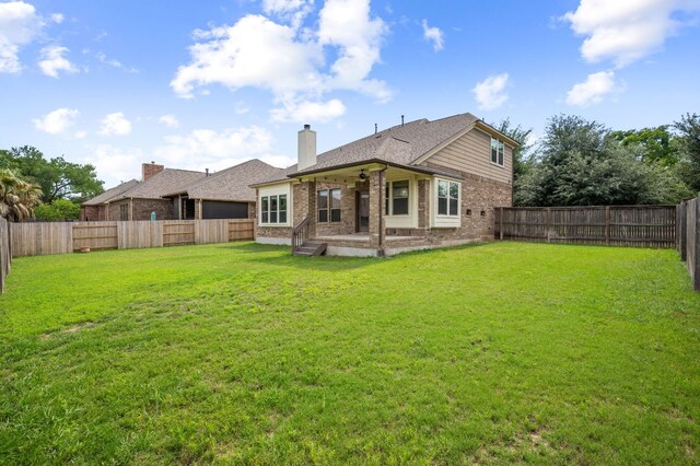 2640 Estefania Ln, Round Rock, TX 78665 - back of house with brick siding, a fenced backyard, a patio area, and a chimney