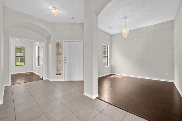 2640 Estefania Ln, Round Rock, TX 78665 - foyer featuring arched walkways and wood finished floors