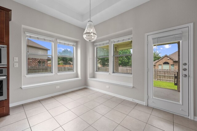 2640 Estefania Ln, Round Rock, TX 78665 - unfurnished dining area featuring healthy amount of natural light, a chandelier, and light tile patterned floors