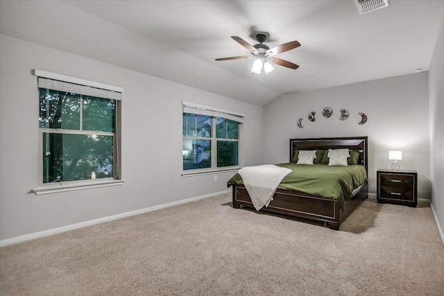 516 E Slaughter Ln Unit 1203, Austin, TX 78744 - carpeted bedroom featuring baseboards, vaulted ceiling, ceiling fan, and multiple windows