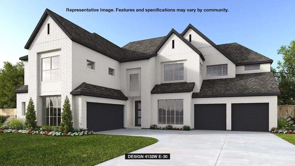 1536 Jolie Rose Bnd, Leander, TX 78641 - view of front of home featuring an attached garage, driveway, and brick siding