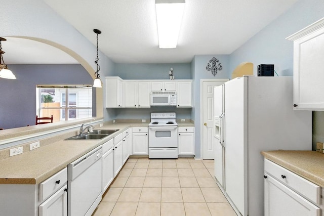 9403 Brandts Wood St, Austin, TX 78744 - kitchen featuring white appliances, decorative light fixtures, white cabinets, and light countertops