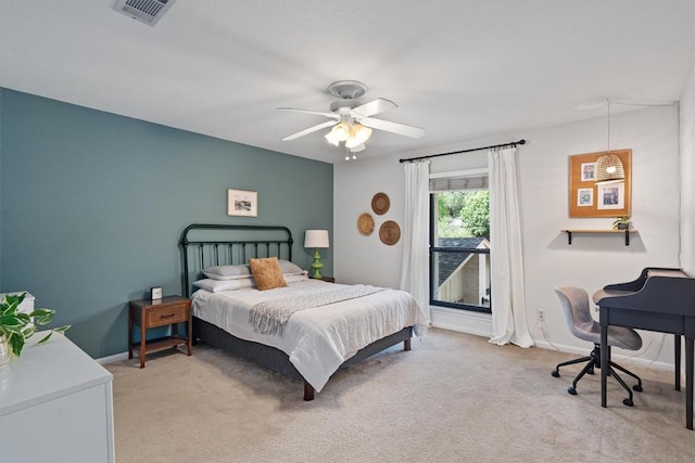 5503 Courtyard Dr, Austin, TX 78731 - bedroom featuring light colored carpet, ceiling fan, and baseboards