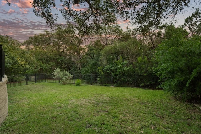 5503 Courtyard Dr, Austin, TX 78731 - yard at dusk with a fenced backyard
