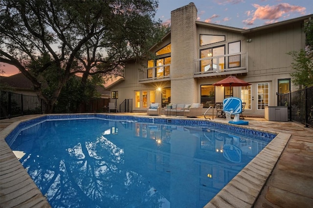 5503 Courtyard Dr, Austin, TX 78731 - view of pool featuring french doors, a fenced backyard, an outdoor hangout area, and a patio