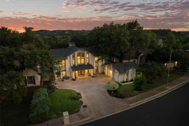 5503 Courtyard Dr, Austin, TX 78731 - view of front of property featuring concrete driveway and stucco siding