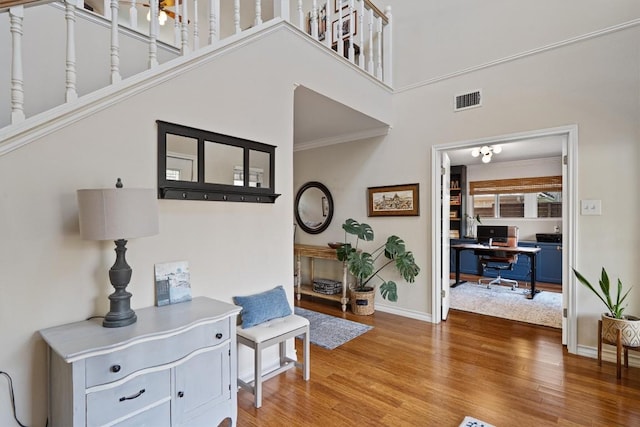 5503 Courtyard Dr, Austin, TX 78731 - foyer entrance with wood finished floors and a high ceiling