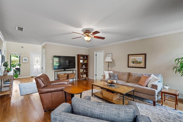 5503 Courtyard Dr, Austin, TX 78731 - living room featuring a ceiling fan, wood finished floors, baseboards, and crown molding