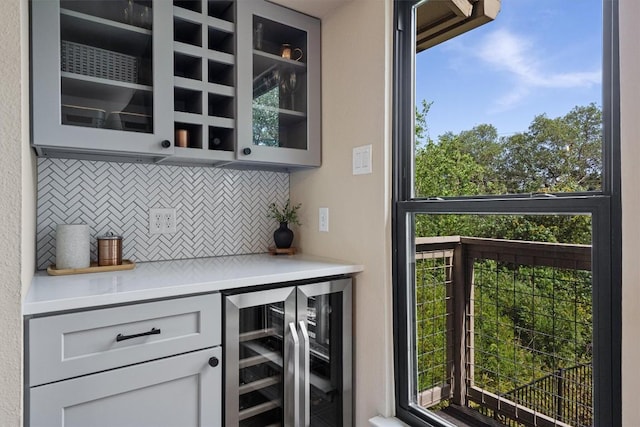 5503 Courtyard Dr, Austin, TX 78731 - indoor dry bar with wine cooler, tasteful backsplash, and healthy amount of natural light