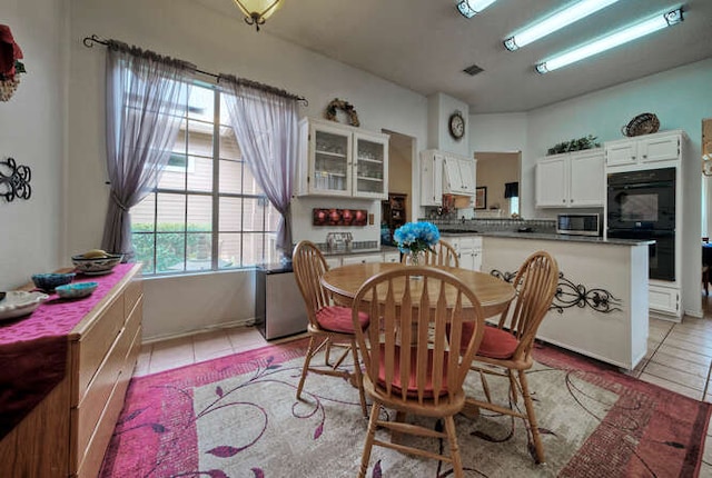 14805 Great Willow Dr, Austin, TX 78728 - dining room with light tile patterned floors