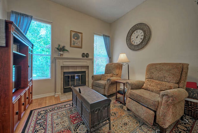 14805 Great Willow Dr, Austin, TX 78728 - living room with healthy amount of natural light, a fireplace, light wood finished floors, and baseboards