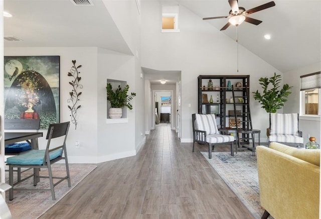 141 Witchhazel Way, San Marcos, TX 78666 - living area with a ceiling fan, wood finished floors, high vaulted ceiling, and recessed lighting