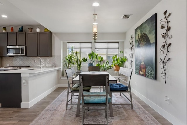 141 Witchhazel Way, San Marcos, TX 78666 - dining area featuring recessed lighting, wood finished floors, and baseboards