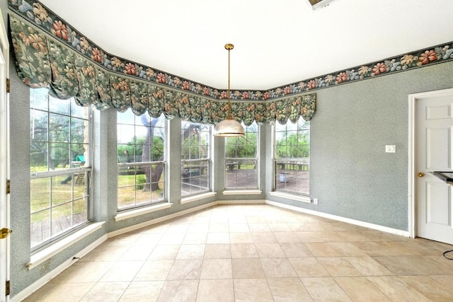 3 Coach House Rd, Austin, TX 78737 - unfurnished dining area featuring baseboards and light tile patterned floors