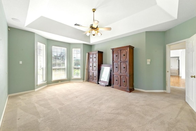 3 Coach House Rd, Austin, TX 78737 - unfurnished bedroom featuring carpet floors, a tray ceiling, baseboards, and ceiling fan