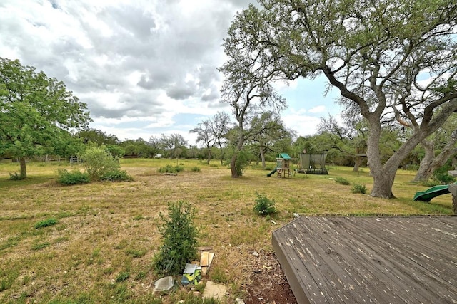 3 Coach House Rd, Austin, TX 78737 - view of grassy yard featuring a playground