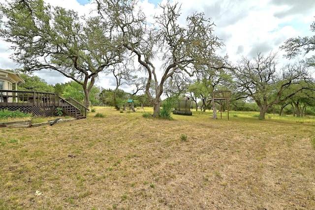 3 Coach House Rd, Austin, TX 78737 - view of grassy yard with a deck and a playground
