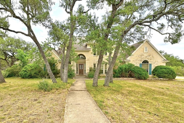 3 Coach House Rd, Austin, TX 78737 - view of front facade featuring stone siding and a front yard