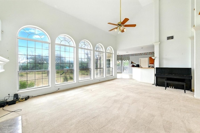 3 Coach House Rd, Austin, TX 78737 - unfurnished living room featuring carpet, a ceiling fan, and a high ceiling