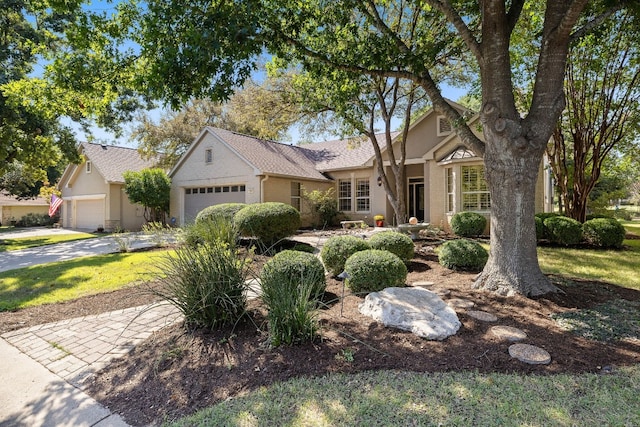 214 Lone Star Dr, Georgetown, TX 78633 - view of front of house with an attached garage, driveway, roof with shingles, and stucco siding