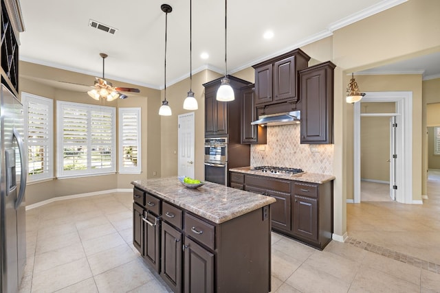 214 Lone Star Dr, Georgetown, TX 78633 - kitchen featuring stainless steel appliances, light tile patterned floors, a ceiling fan, baseboards, and crown molding