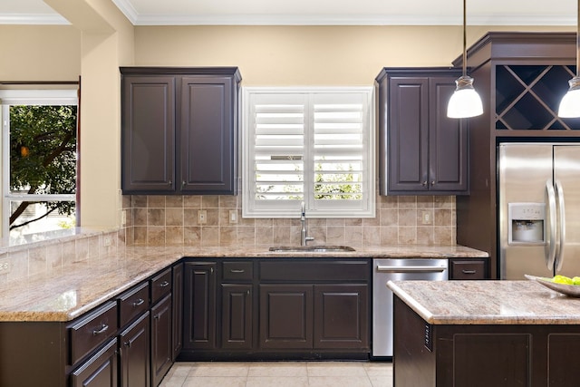 214 Lone Star Dr, Georgetown, TX 78633 - kitchen with appliances with stainless steel finishes, tasteful backsplash, ornamental molding, light stone countertops, and light tile patterned flooring