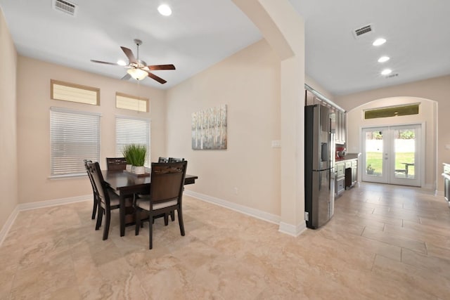 6321 Llano Stage Trl, Austin, TX 78738 - dining area with arched walkways, a ceiling fan, recessed lighting, french doors, and baseboards