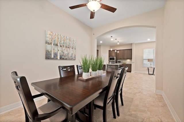6321 Llano Stage Trl, Austin, TX 78738 - dining room with arched walkways, ceiling fan, recessed lighting, and baseboards