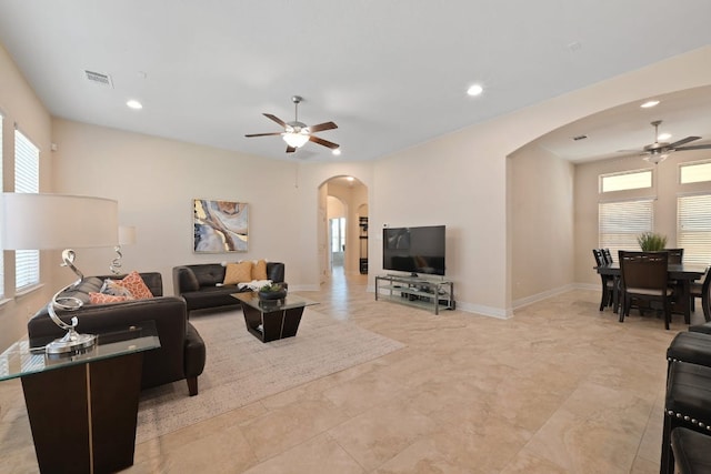 6321 Llano Stage Trl, Austin, TX 78738 - living area with a ceiling fan, arched walkways, recessed lighting, and baseboards