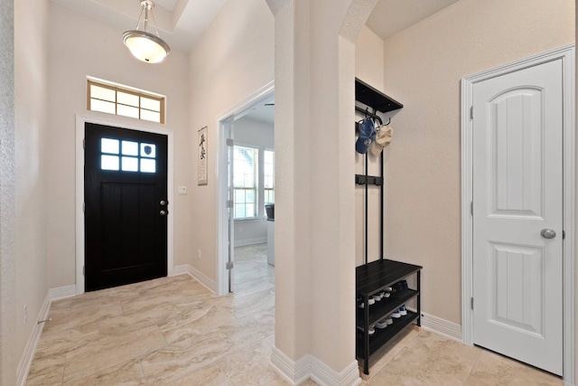 6321 Llano Stage Trl, Austin, TX 78738 - entrance foyer with arched walkways, healthy amount of natural light, and baseboards