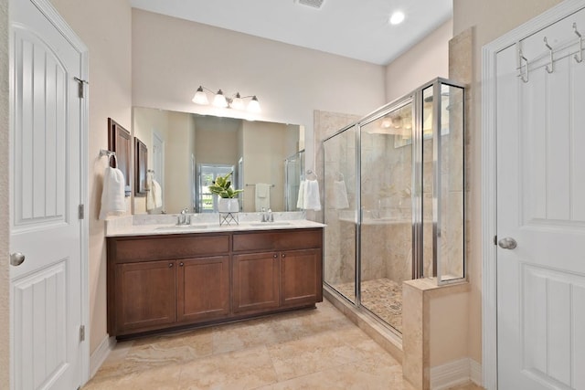 6321 Llano Stage Trl, Austin, TX 78738 - full bath with a shower stall, double vanity, and baseboards
