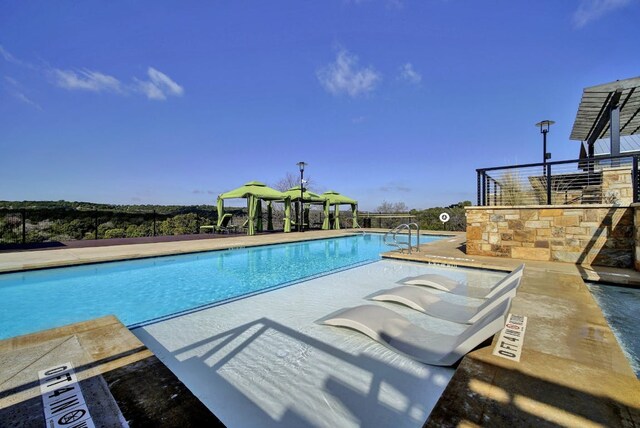 6321 Llano Stage Trl, Austin, TX 78738 - community pool featuring a gazebo and a patio