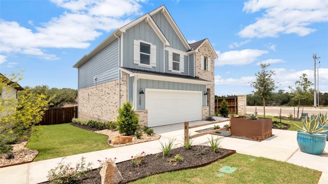 100 Heatherwood Ter, Marble Falls, TX 78654 - view of front of house featuring board and batten siding, a garage, driveway, and brick siding