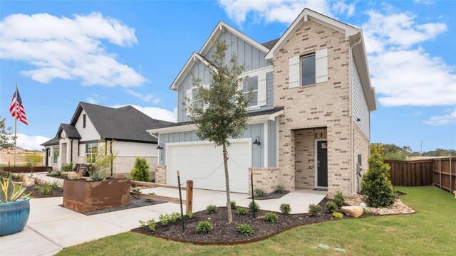 100 Heatherwood Ter, Marble Falls, TX 78654 - view of front of home featuring board and batten siding, an attached garage, concrete driveway, and brick siding